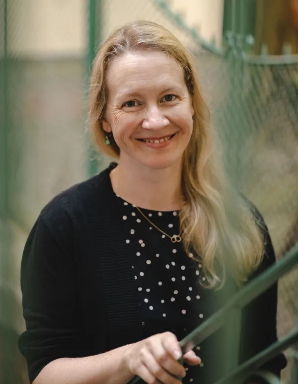 a blond woman smiling into the camera