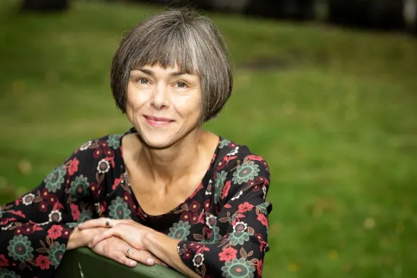 Mia Lövheim in a colorful floral shirt.