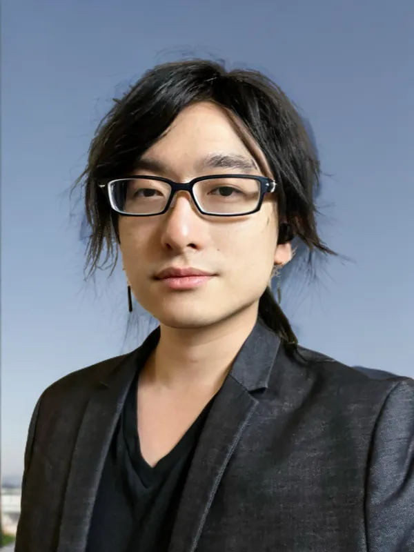 Acer Chang. Acer Chang wearing a black blazer and glasses.